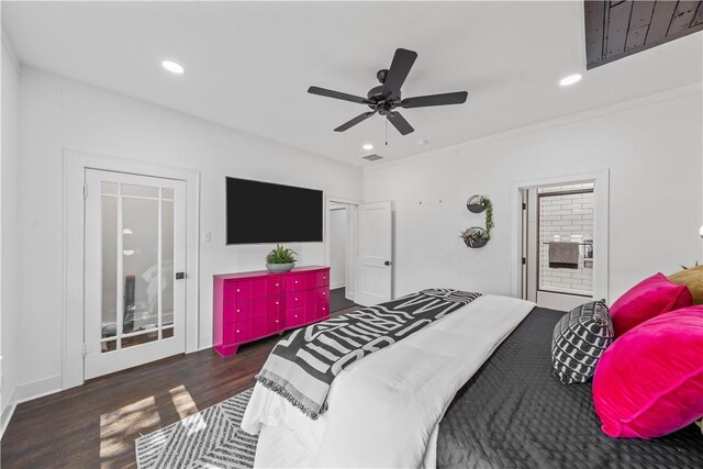 bedroom with crown molding, ceiling fan, and dark wood-type flooring