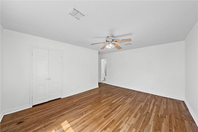 interior space with hardwood / wood-style floors and ceiling fan