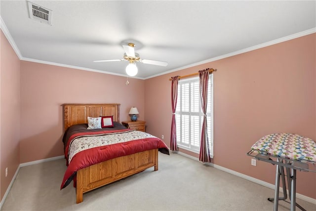 bedroom with light colored carpet, ceiling fan, and crown molding