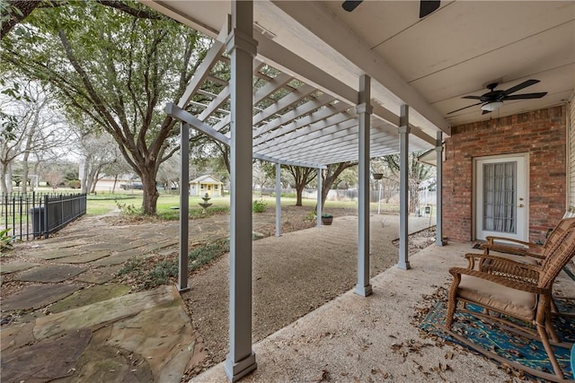 view of patio with ceiling fan and a pergola