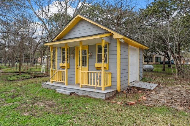 view of outbuilding featuring a yard