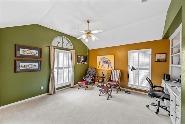 home office featuring ceiling fan, carpet floors, and vaulted ceiling