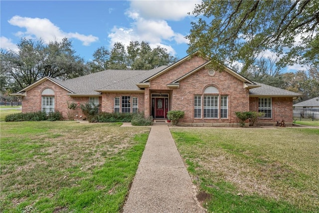 ranch-style home with a front yard