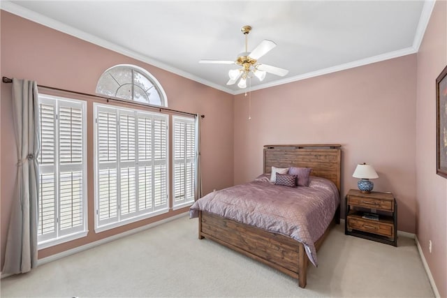 bedroom featuring ceiling fan, ornamental molding, and light carpet