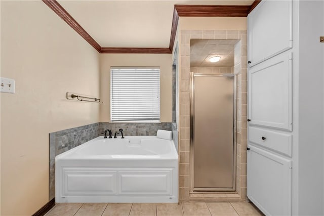 bathroom featuring tile patterned flooring, ornamental molding, and independent shower and bath