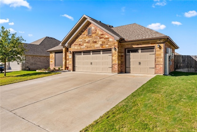 view of front facade featuring a front yard and a garage