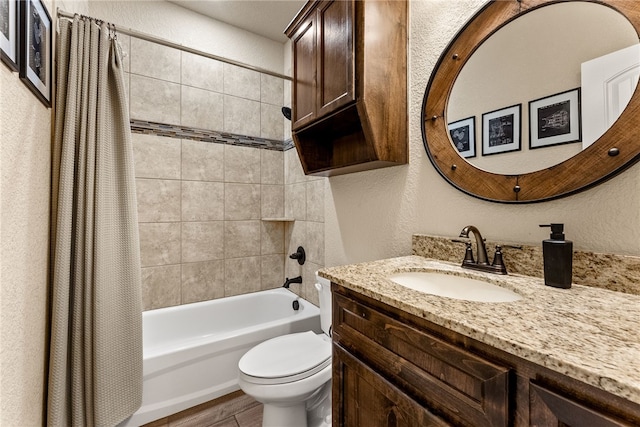 full bathroom with vanity, shower / tub combo, and toilet