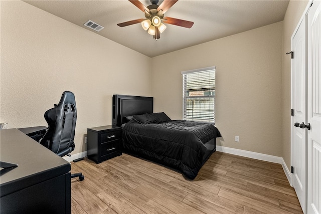 bedroom featuring ceiling fan and light wood-type flooring