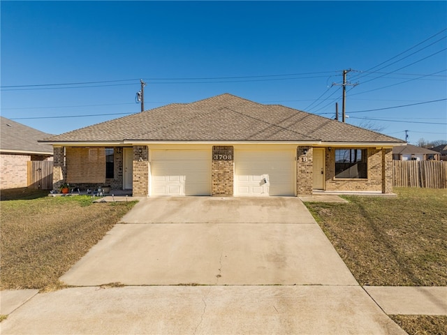 single story home with a front yard, concrete driveway, fence, and an attached garage