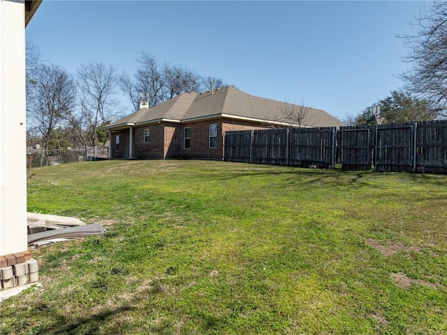 view of yard featuring a fenced backyard