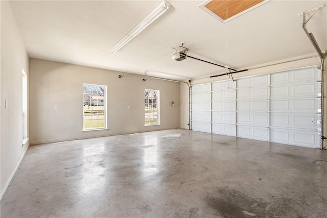 garage with baseboards and a garage door opener