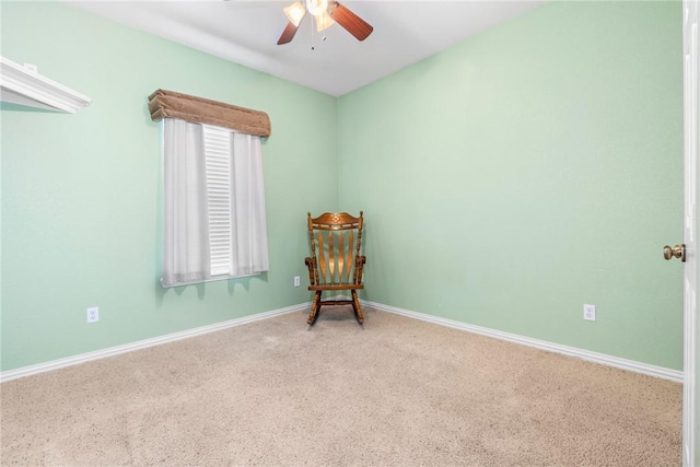 unfurnished room featuring a healthy amount of sunlight, carpet flooring, a ceiling fan, and baseboards