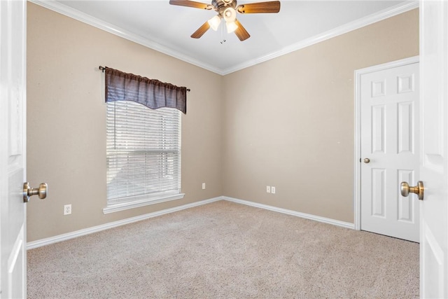 empty room with light carpet, ceiling fan, ornamental molding, and baseboards