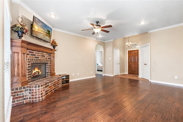 unfurnished living room with baseboards, dark wood-style flooring, a fireplace, and crown molding