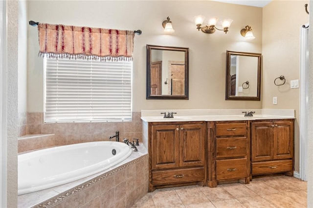 full bathroom with double vanity, a garden tub, a sink, and tile patterned floors