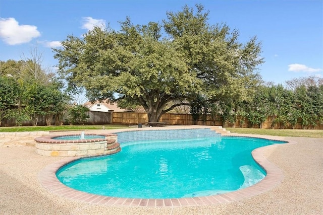 view of pool featuring an in ground hot tub