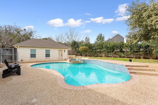 view of pool with a patio area and an in ground hot tub