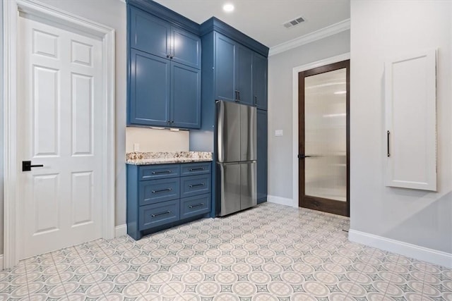 kitchen with crown molding, blue cabinets, stainless steel fridge, and light stone counters