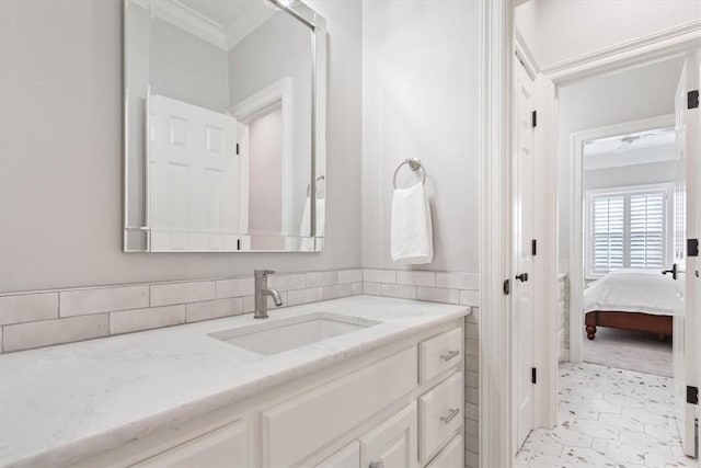 bathroom with vanity and ornamental molding