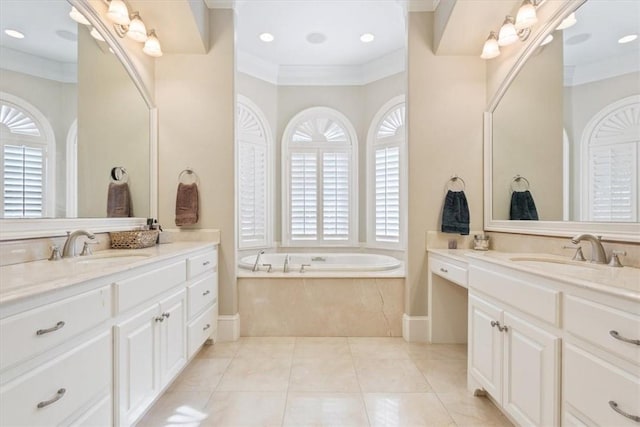 bathroom featuring tiled bath, vanity, ornamental molding, and tile patterned flooring