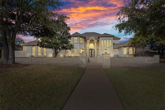 view of front of house with a yard