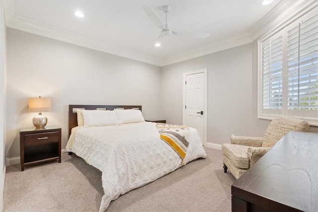 bedroom featuring ceiling fan, light carpet, and crown molding