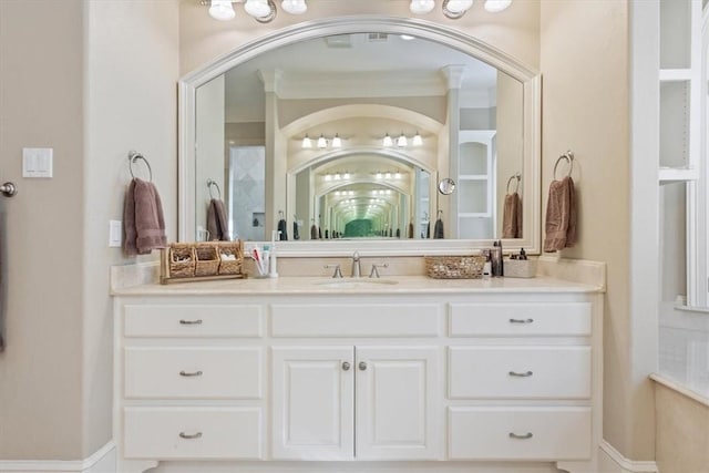 bathroom with vanity and crown molding