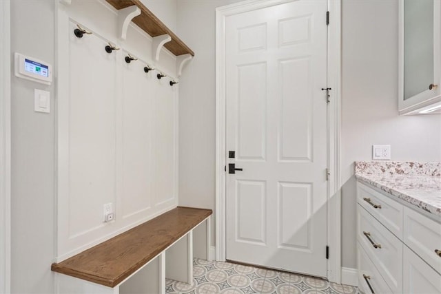 mudroom with light tile patterned flooring