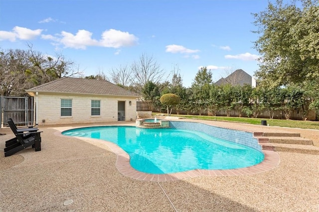 view of pool featuring a patio area and an in ground hot tub