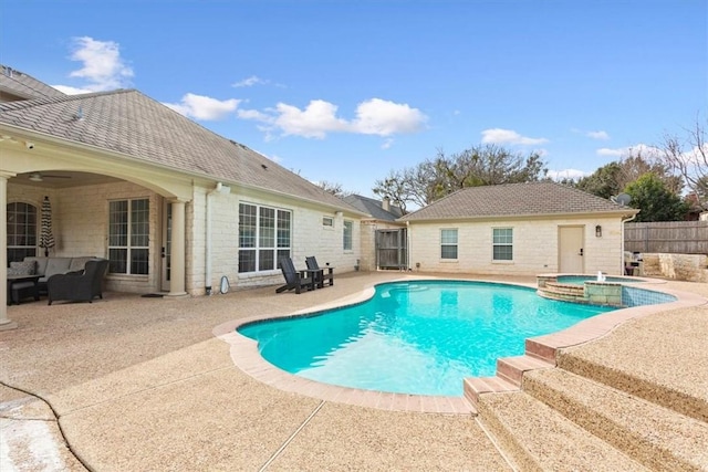 view of pool featuring an in ground hot tub and a patio