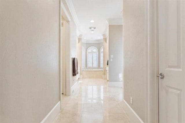 corridor featuring crown molding