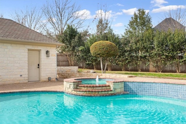 view of swimming pool with an in ground hot tub and pool water feature