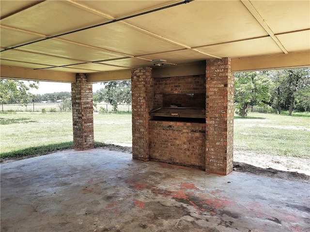 view of patio / terrace with an outdoor fireplace