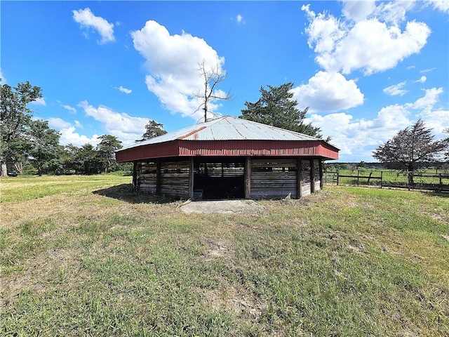 exterior space with an outbuilding and a rural view