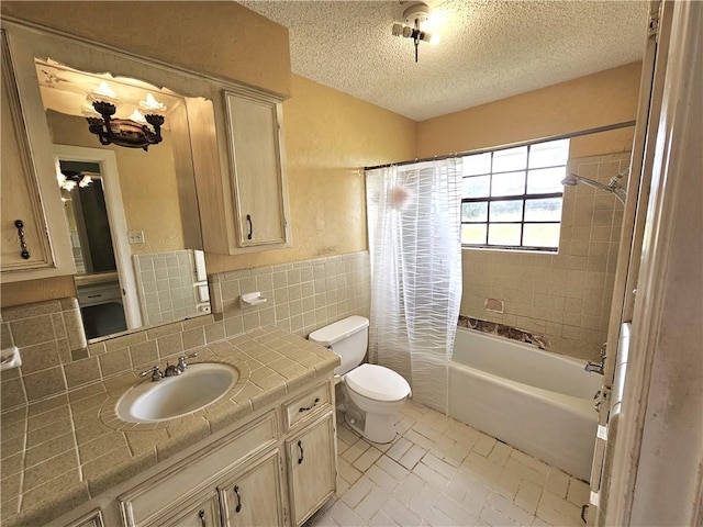 full bathroom with a textured ceiling, vanity, shower / tub combo, and toilet