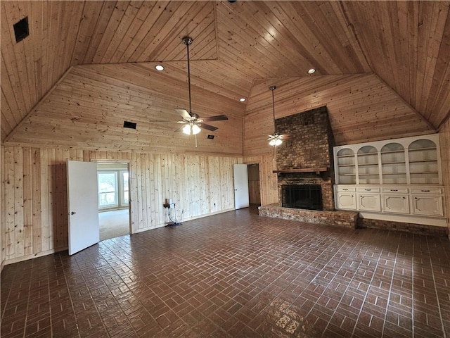 unfurnished living room featuring a brick fireplace, high vaulted ceiling, and wood ceiling