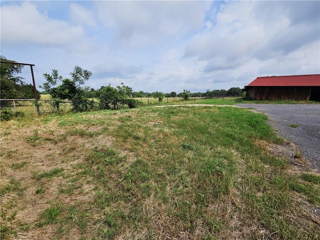 view of yard with a rural view