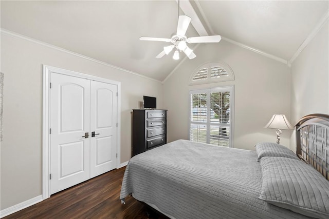 bedroom featuring lofted ceiling, dark wood-type flooring, a closet, ceiling fan, and crown molding