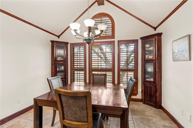 dining room featuring vaulted ceiling, a notable chandelier, and crown molding