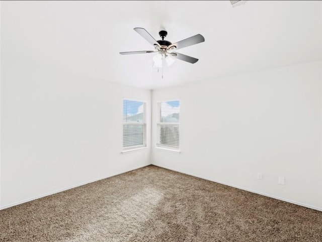 empty room with carpet flooring and ceiling fan