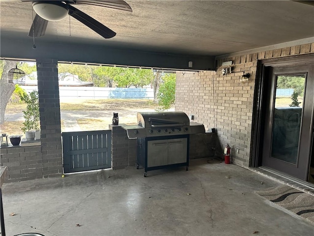 view of patio / terrace featuring area for grilling and ceiling fan