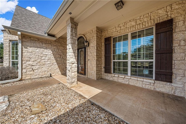 property entrance featuring covered porch