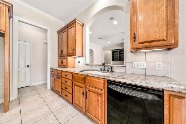 kitchen featuring sink, crown molding, light tile patterned floors, black dishwasher, and light stone counters