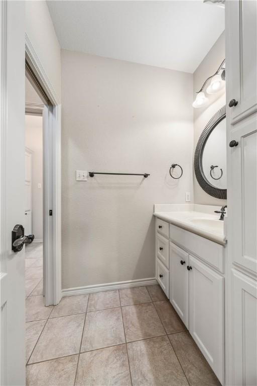 bathroom with tile patterned flooring and vanity