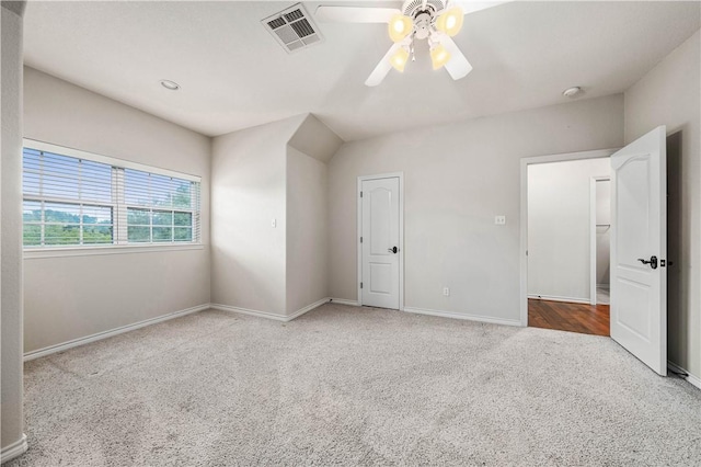 unfurnished bedroom with ceiling fan and light carpet