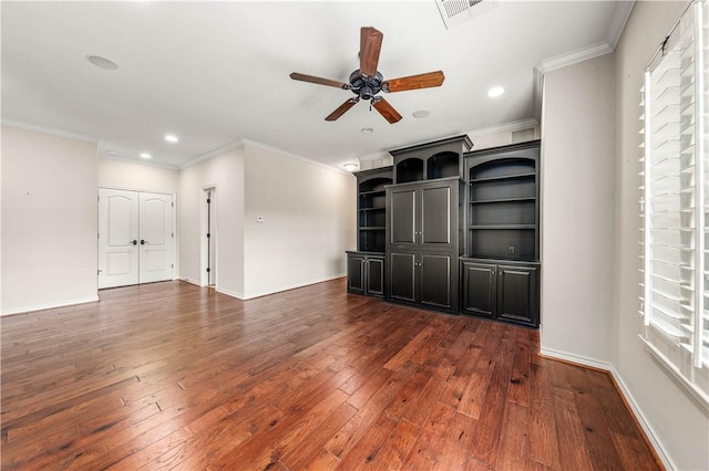 unfurnished living room featuring ornamental molding, ceiling fan, and dark wood-type flooring