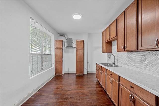 kitchen featuring decorative backsplash, sink, and dark wood-type flooring