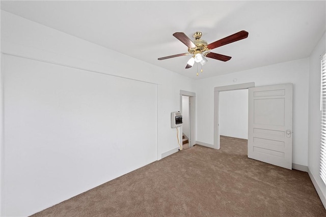 unfurnished bedroom featuring carpet flooring and ceiling fan