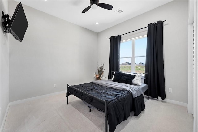 carpeted bedroom with ceiling fan