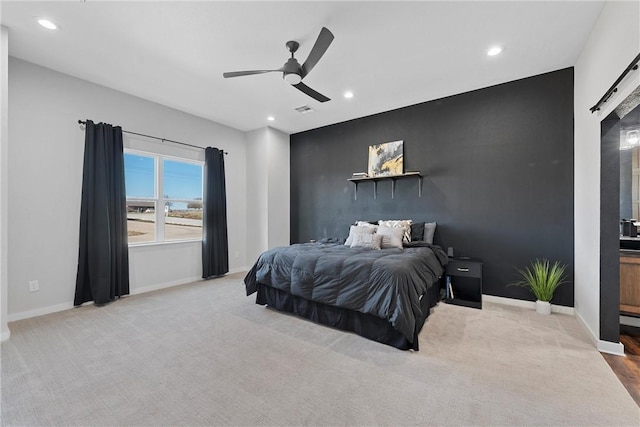 bedroom featuring ceiling fan and light colored carpet